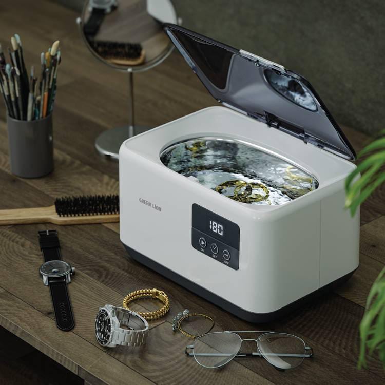 Green Lion Ultrasonic Cleaner Basket With Jewelry, Watch, Glasses are Placed Nearby.