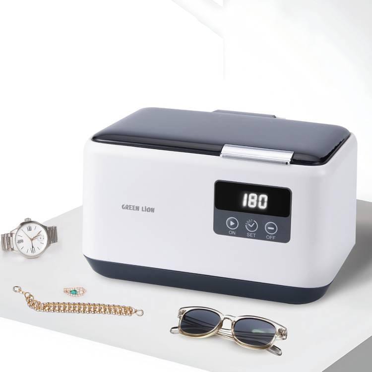 Green Lion Ultrasonic Cleaner Basket With Jewelry, Watch, Glasses are Placed Nearby.