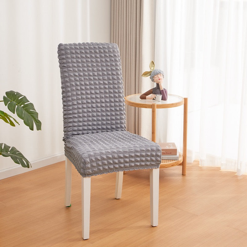 A Chair is Covered With Grey Bubble Stuff Stretchable Chair Cover 