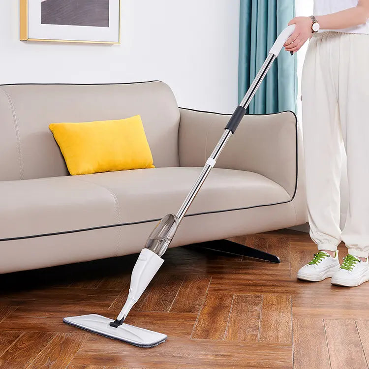 A person cleaning floor of a living room using Lightweight Water Spray Mop