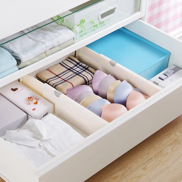 A drawer full of clothes and underwear separated with the help of drawer separator