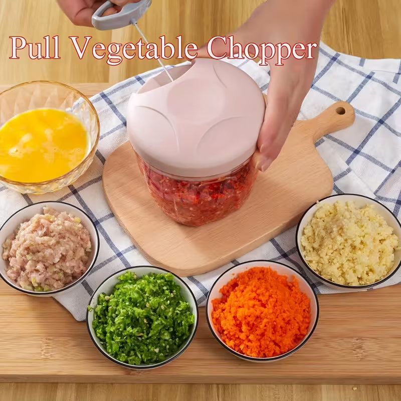 Pull Vegetable Chopper in use with chopped vegetables on a wooden cutting board.