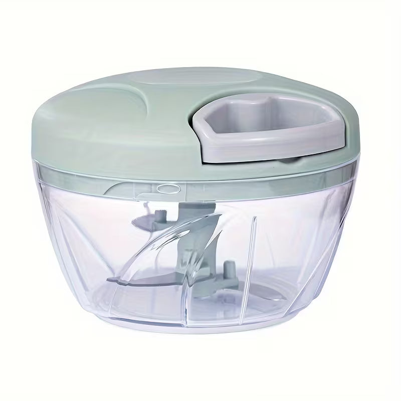 Handheld food chopper with a clear container and light green lid on a white background