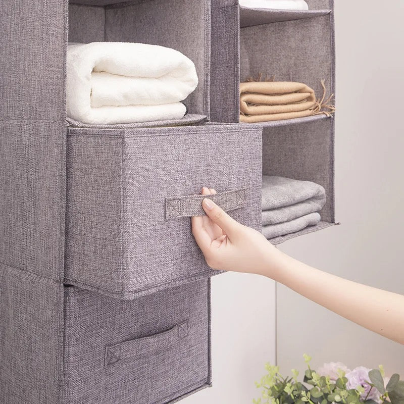  Someone organizing wardrobe clothes storage bags