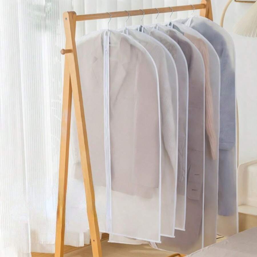 Cloths Are Hanged On Hanging Garment Bags,