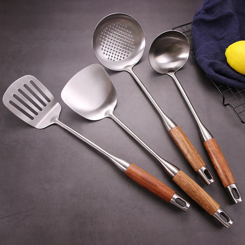 6 Pcs Stainless Steel Kitchenware Spatula Set with Wooden Handle placed on the floor next to something