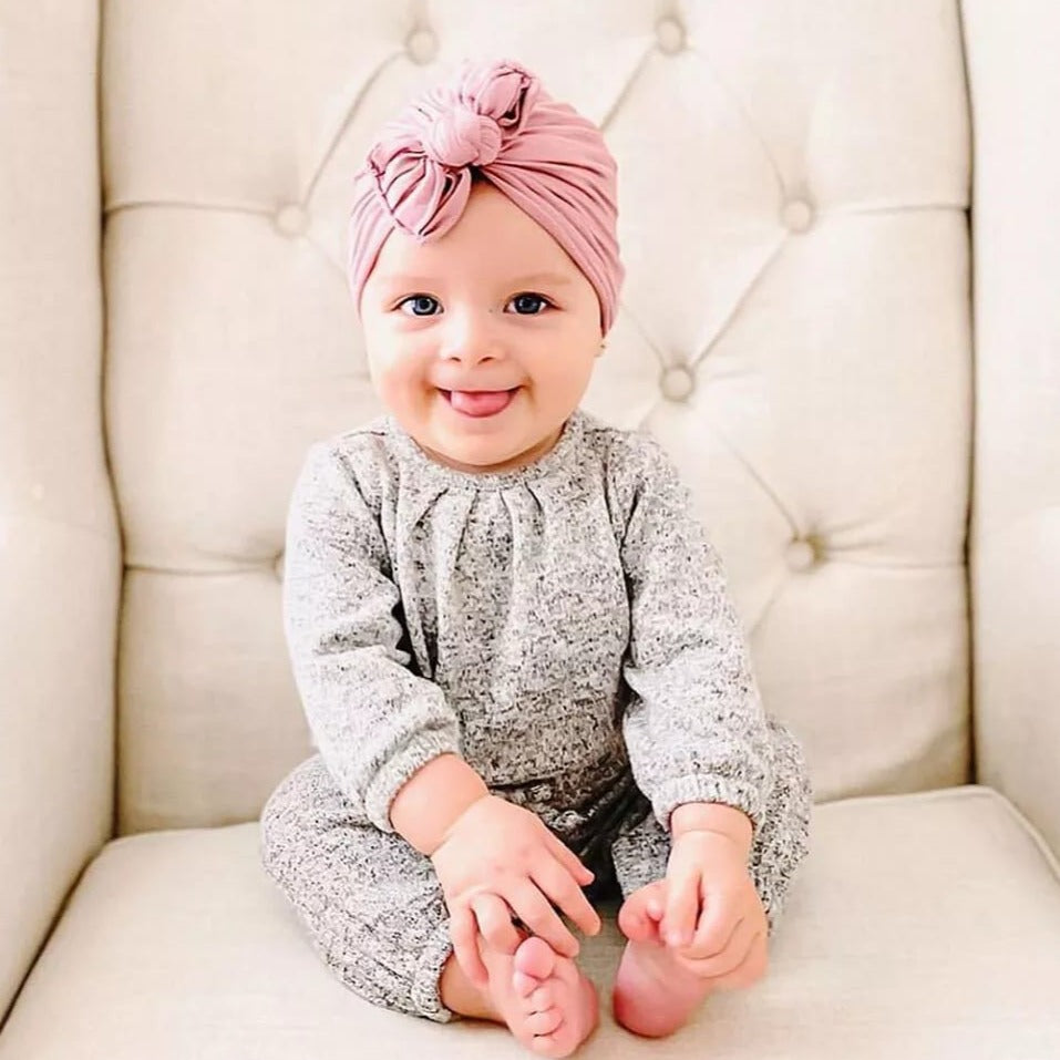 A Cute Baby Wearing Soft Headband.