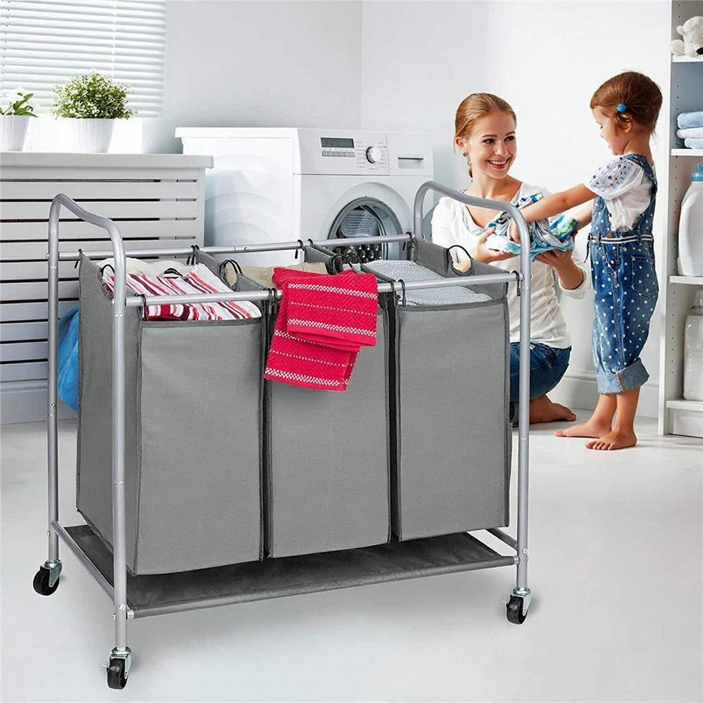 A Woman and Her Baby is Filling Laundry Clothes in to Heavy Duty Laundry Sorter Cart.