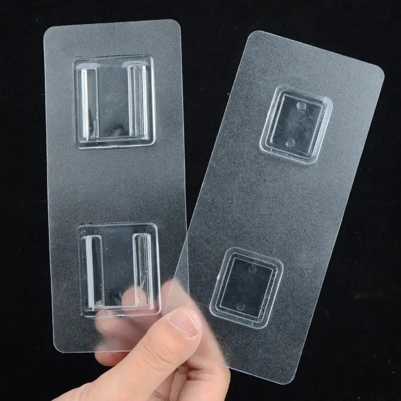 A Person is Holding Double Sided Adhesive Wall Hook Hanger Strip.