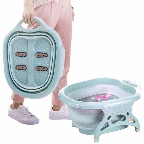 A Women is Holding Folding Foot Tub Portable Foot Wash Tub Massage Bucket.Folding Foot Tub Portable Foot Wash Tub Massage Bucket. 