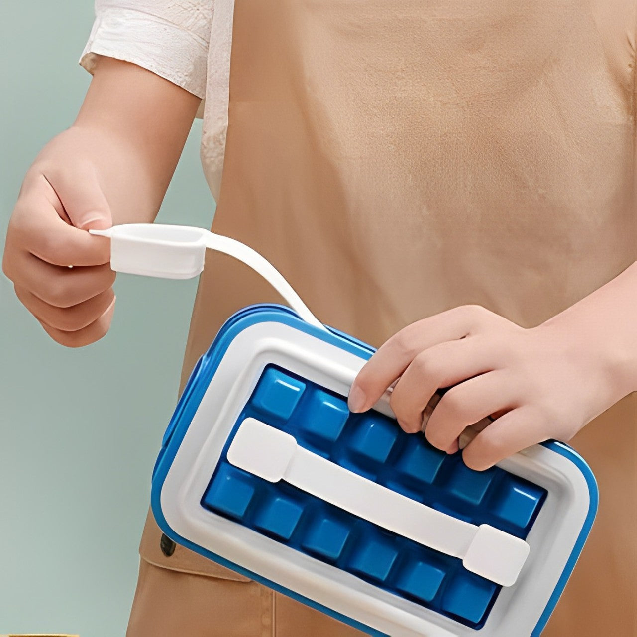 A Person is Opening Lid Of Ice Cube Tray.