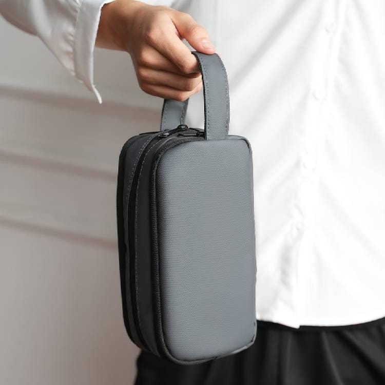 A Person is Holding Multi-Purpose Travel Organizer Pouch.