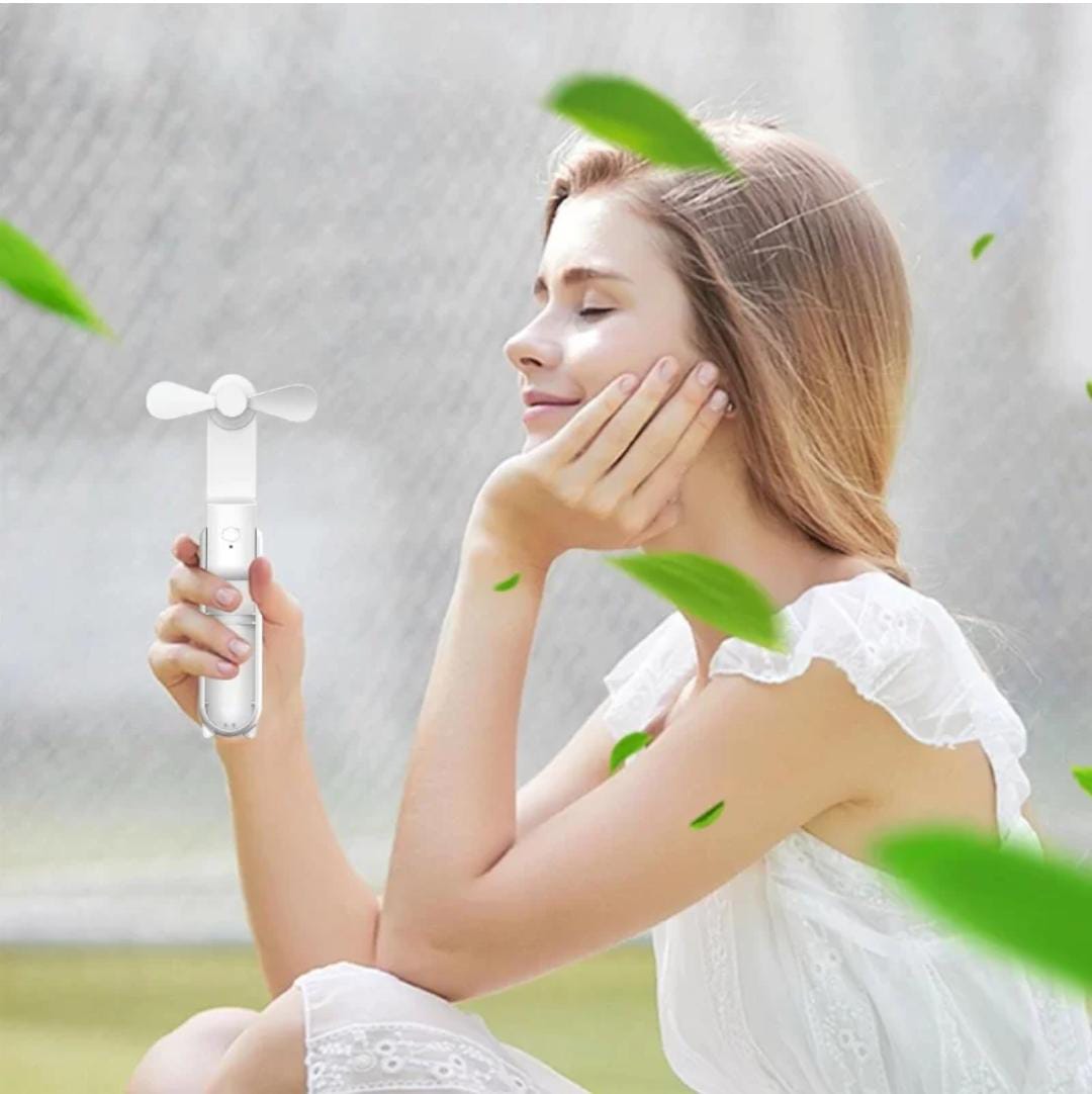 A Girl is Holding Multifunction Folding Mini Fan.