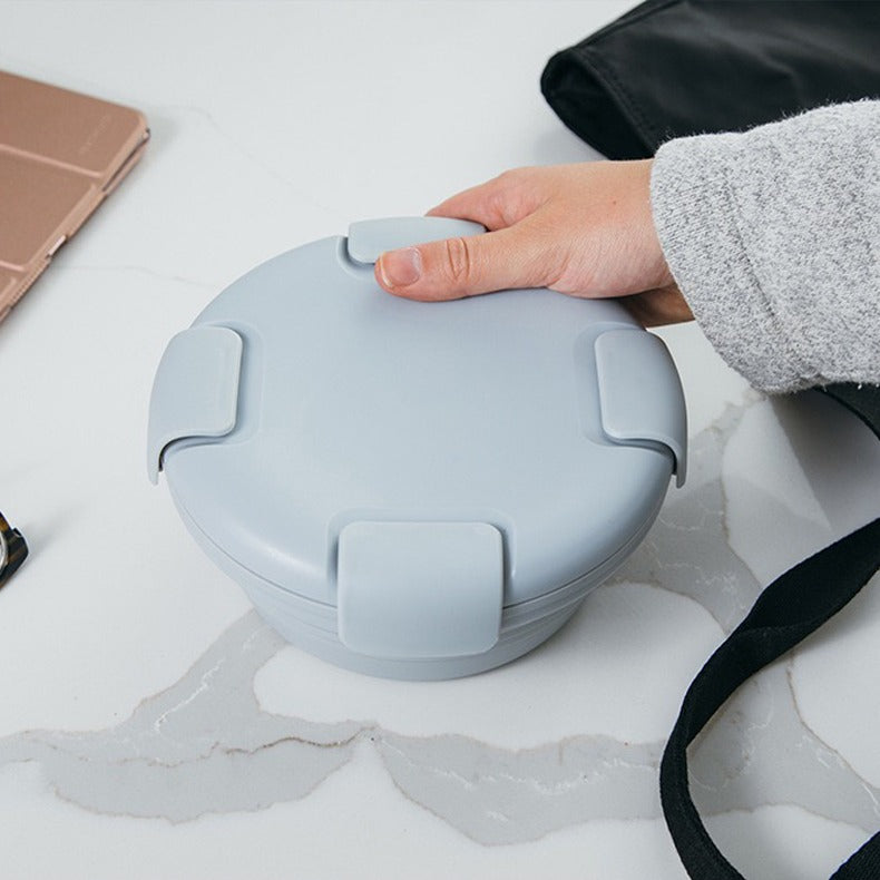 A Person is Holding Silicone Bowl Food Container.