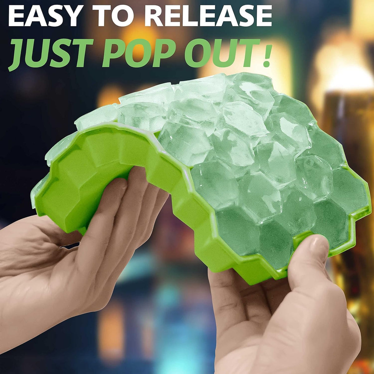 Honeycomb Silicone Ice Cube Tray with clear ice cubes being pulled out, against a blurred background.