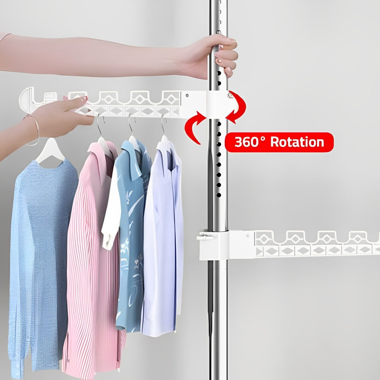 A Women is Pulling the Hooks Of Upright Coat Rack Organized with Clothes.