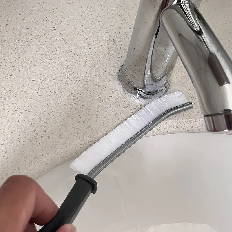 Someone is cleaning the pipes with the help of a Gap Cleaning Brush