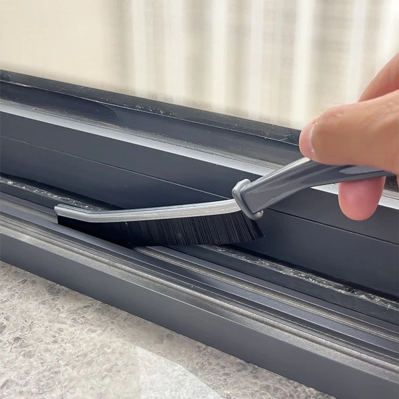 Someone cleaning window gap with Gap Cleaning Brush