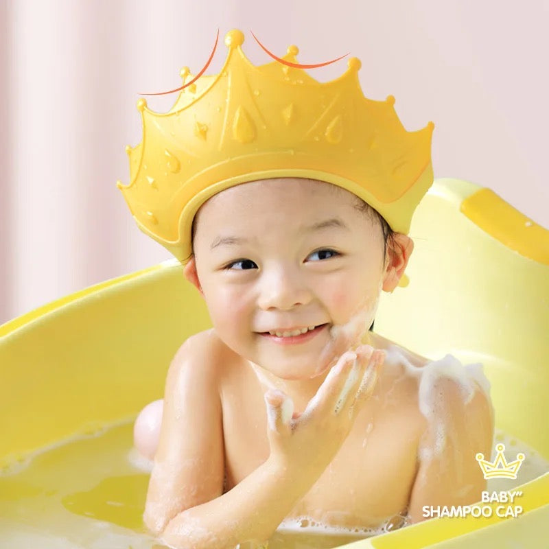 Baby wearing a baby shampoo cap