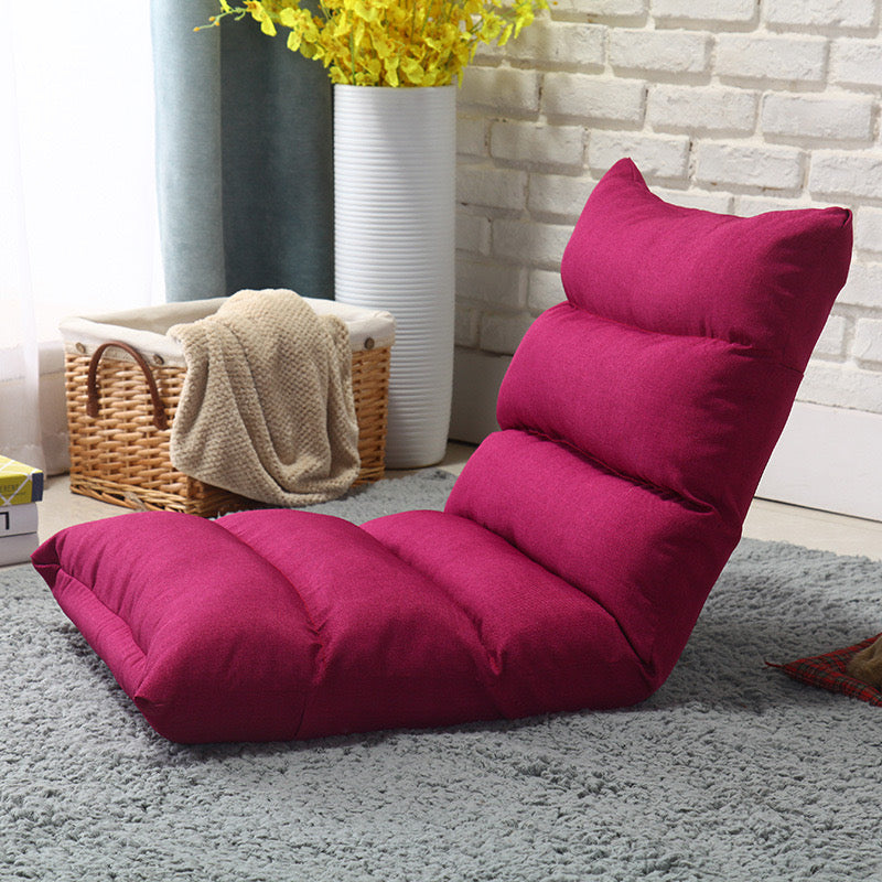 Rose color Lazy Lounge Sofa Bed placed near to a basket with cloths