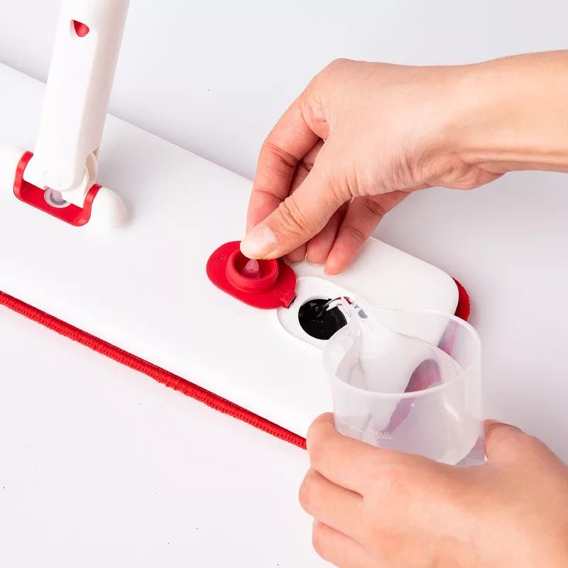 Someone pressing the switch on the Hands-Free Spray Mop