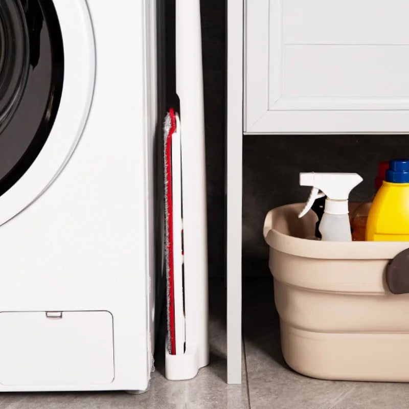 Hands-Free Spray Mop placed next to washing machine