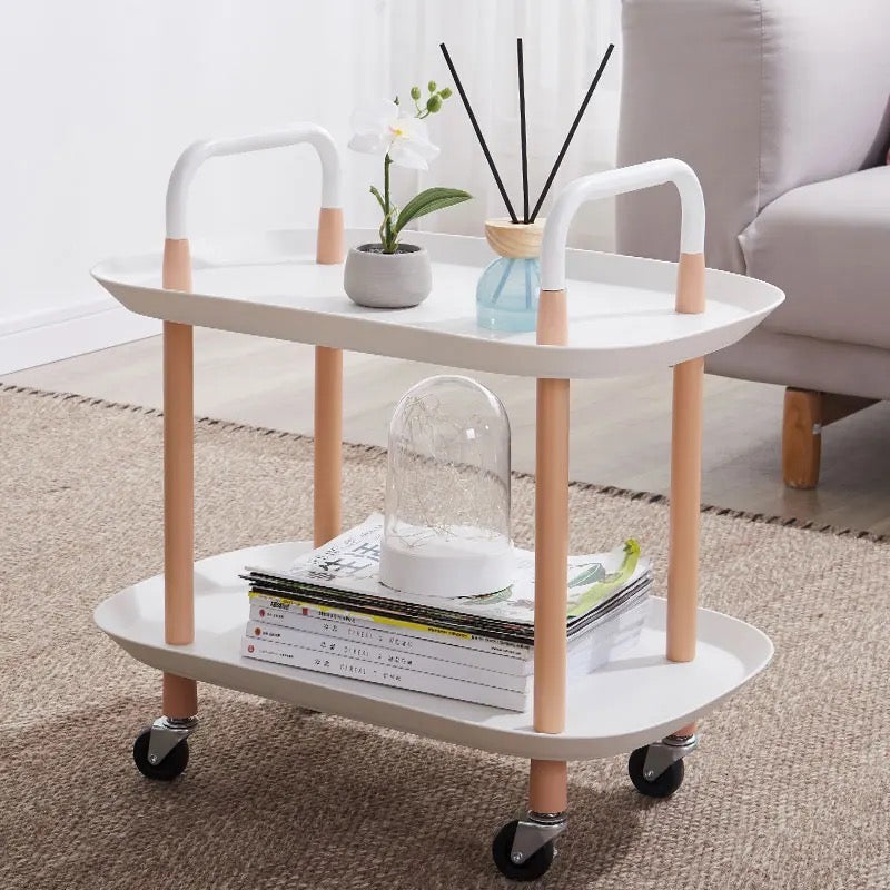 Multi-tier Mobile Storage Table placed on the floor and arranged with some things