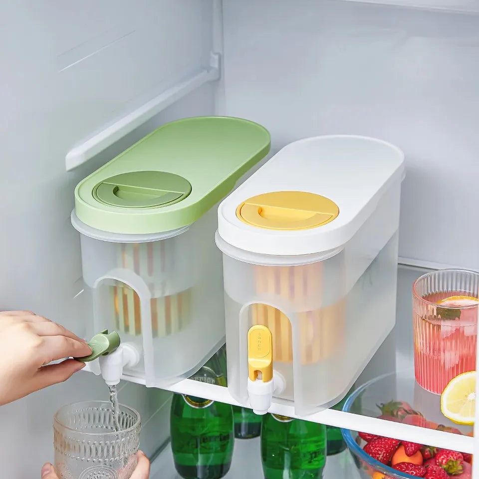 A person pouring water into a glass using Cold Kettle Beverage Dispenser