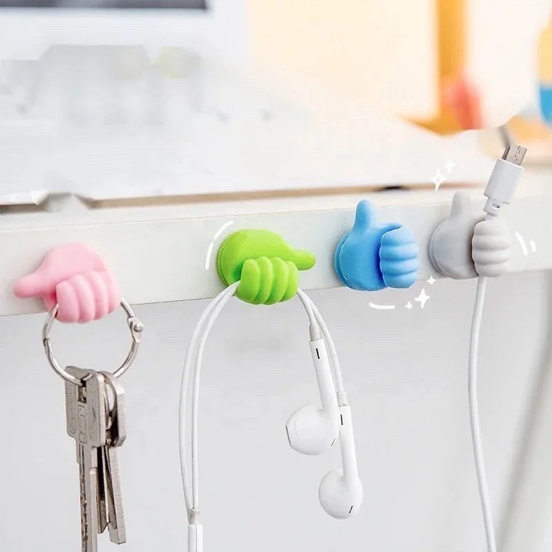 different Color Multifunctional Mini Handy Organizer Hook, Silicone Thumb Hook Cable Manager, arranged in an orderly manner on a desk, create a visually appealing