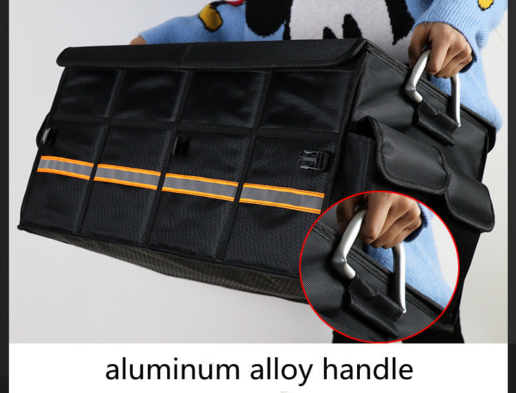 A person holding a black tools storage bag