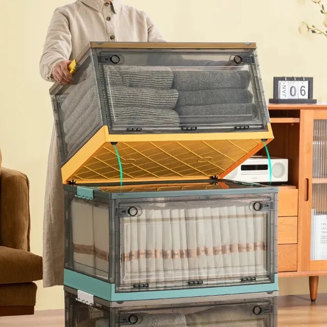 A person standing next to a foldable plastic storage boxes