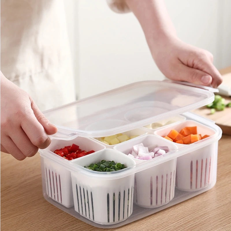 A woman holds a plastic container with food in it. The 6-Grids Useful Refrigerator Food Fresh-keeping Storage Box is perfect for keeping food fresh