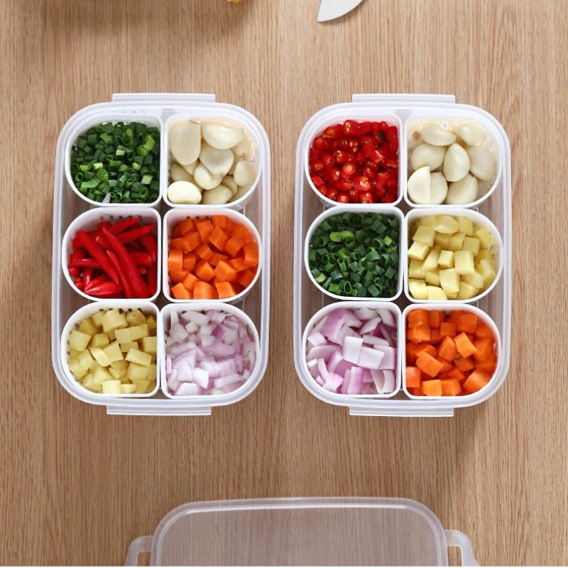  A useful refrigerator storage box with six compartments, filled with 6 types of fresh vegetables