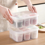 A woman holds a plastic container with food in it. The 6-Grids Useful Refrigerator Food Fresh-keeping Storage Box is perfect for keeping food fresh