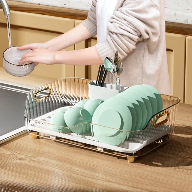 Someone cleaning plates with the help of Kitchen Sink Dish Storage Drain Rack