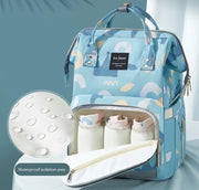 Stay organized with this fashionable blue and white patterned diaper bag, equipped with a bottle holder and designed as a waterproof mummy backpack for hassle-free travel.