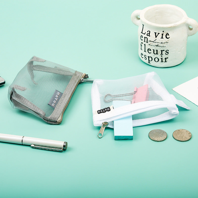 A compact Mini Zipper Pouch, designed for convenient storage and organization of small items