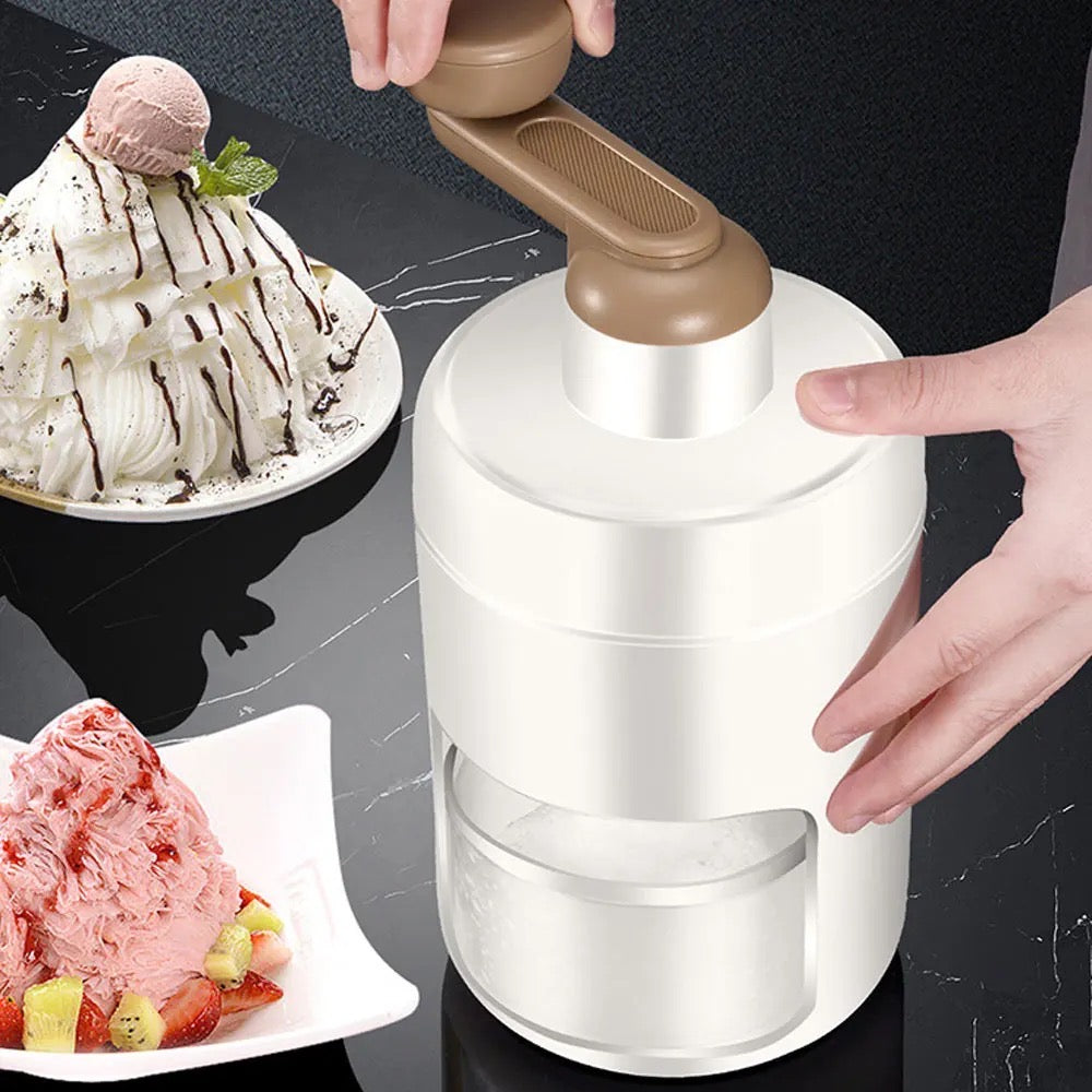 A person is using a portable manual ice crusher and shaver to successfully grind ice in a blender