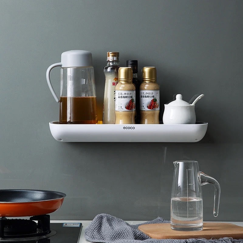 punch-free  storage rack, cleverly mounted on the wall, featuring a practical shelf for organizing essentials