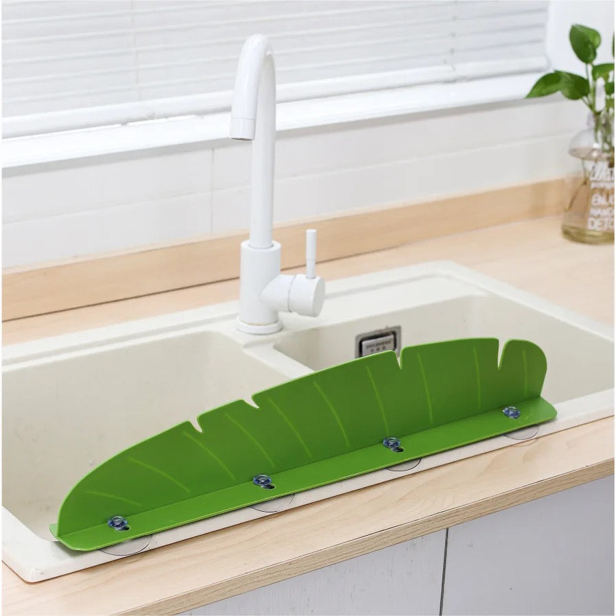 Kitchen Sink Splash Guard installed on a sink showing it's backside 