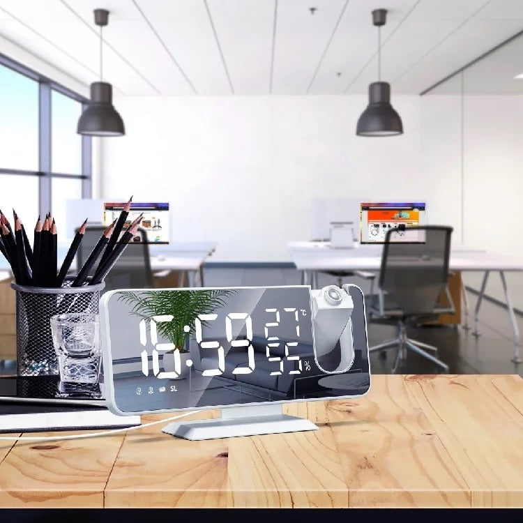LED Projection Alarm Clock kept on top of office table displaying time
