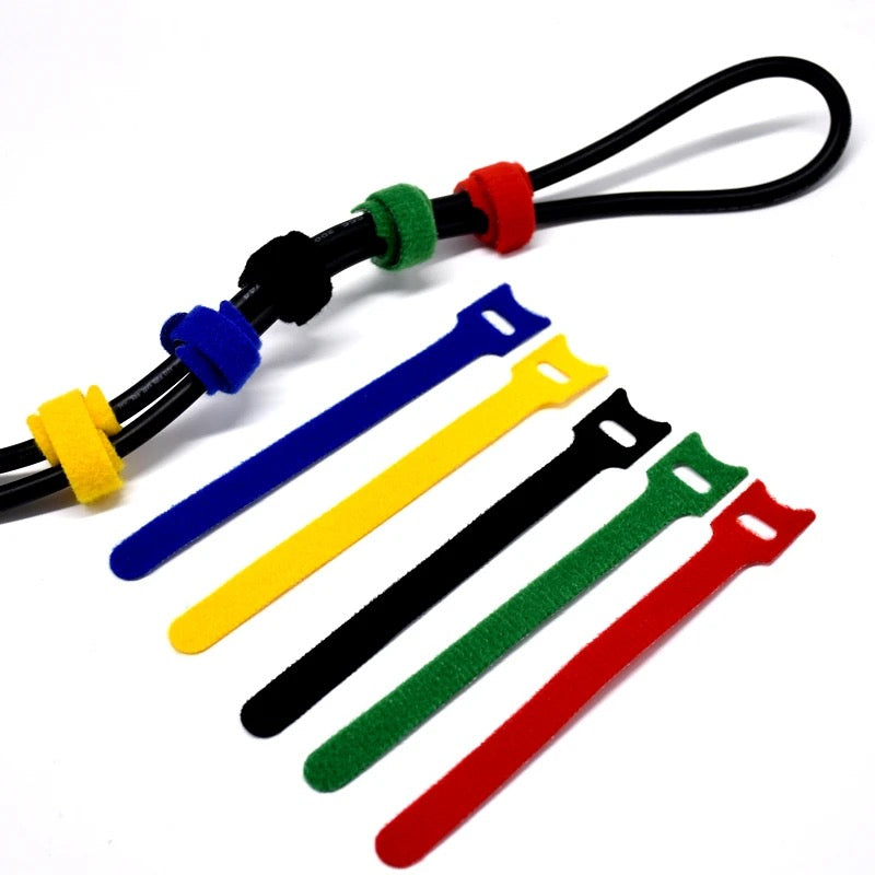 A wire tied using Reusable Wire and Cable Ties Strap and placed beside to all color variants of the product
