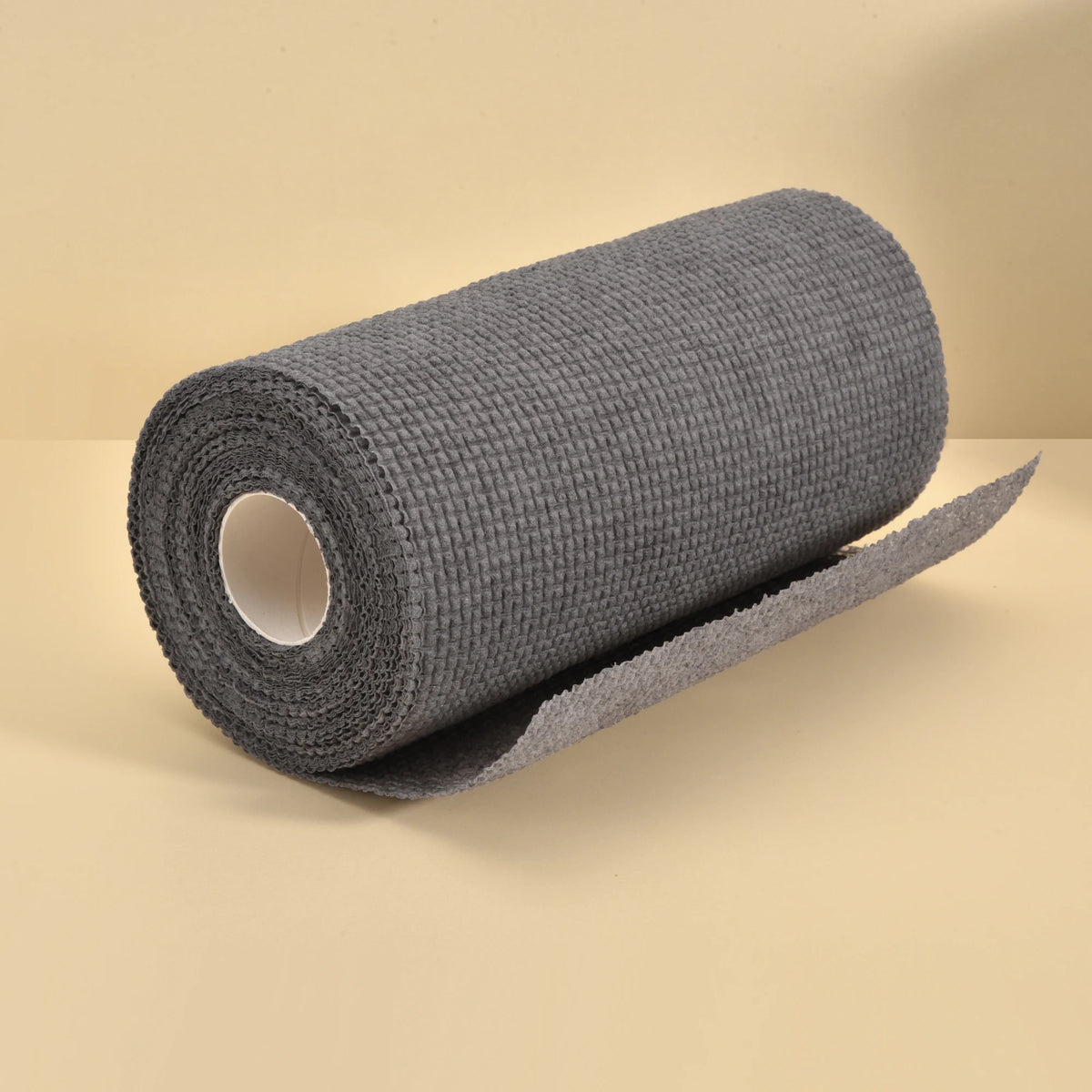 1 Roll/25pcs Disposable Kitchen Cleaning Cloth Roll placed unwrapped on a surface 