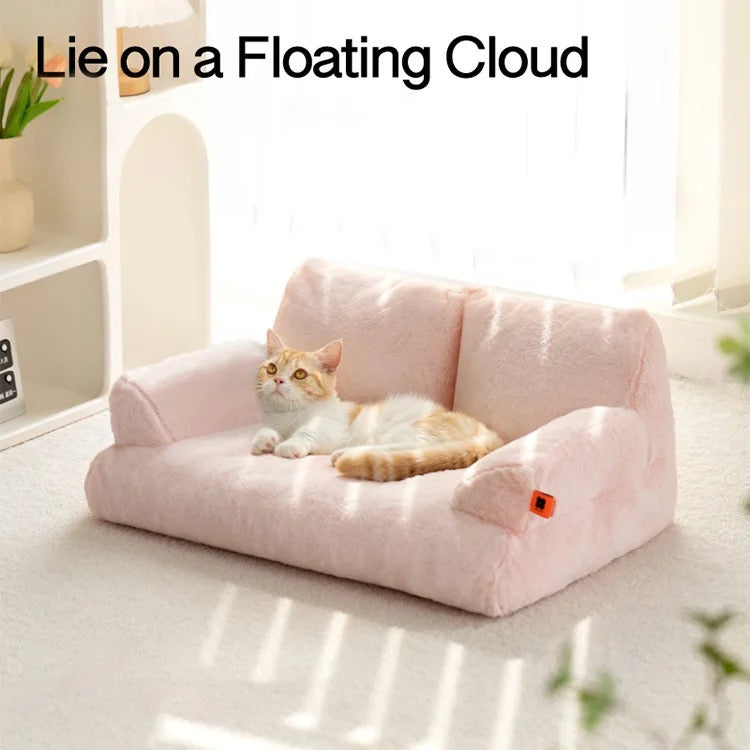 A cat lying on a pink color Cat Sofa Couch Cushion 