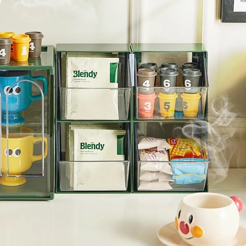 a Multi-Layer Desktop Dustproof Storage Rack with different types of Coffee, Tea Bag in it