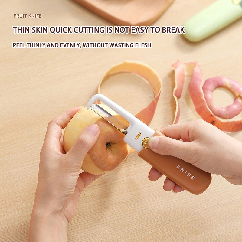 A person peeling an apple using 2 in 1 Knife and Peeler 