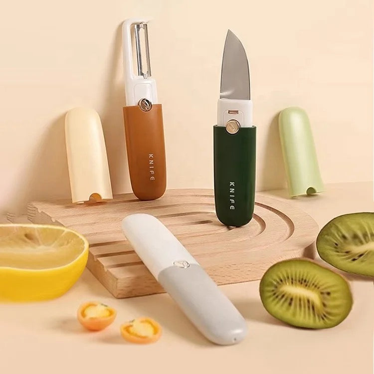 2 in 1 Knife and Peeler in 2 different colors placed on top of a cutting board exposing it's both sides of peeler and knife 