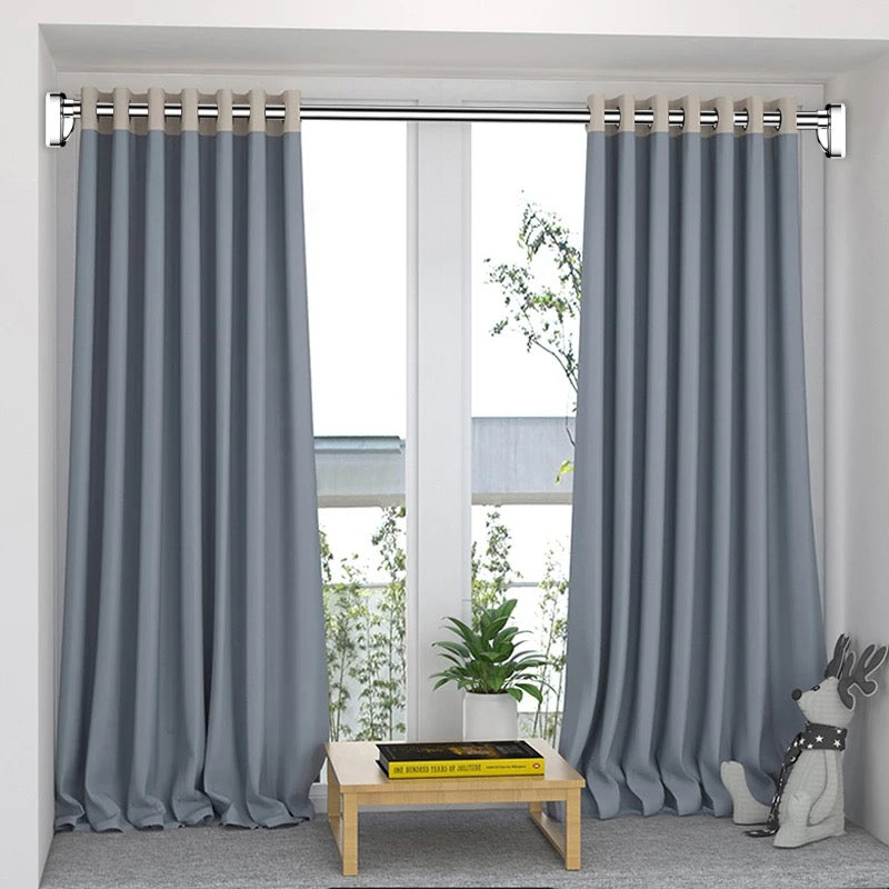 Extendable Tension Rod along with curtain mounted on a balcony door in a room