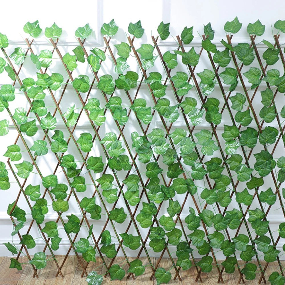 Artificial leaf fence placed on a surface of a room by sticking to a wall