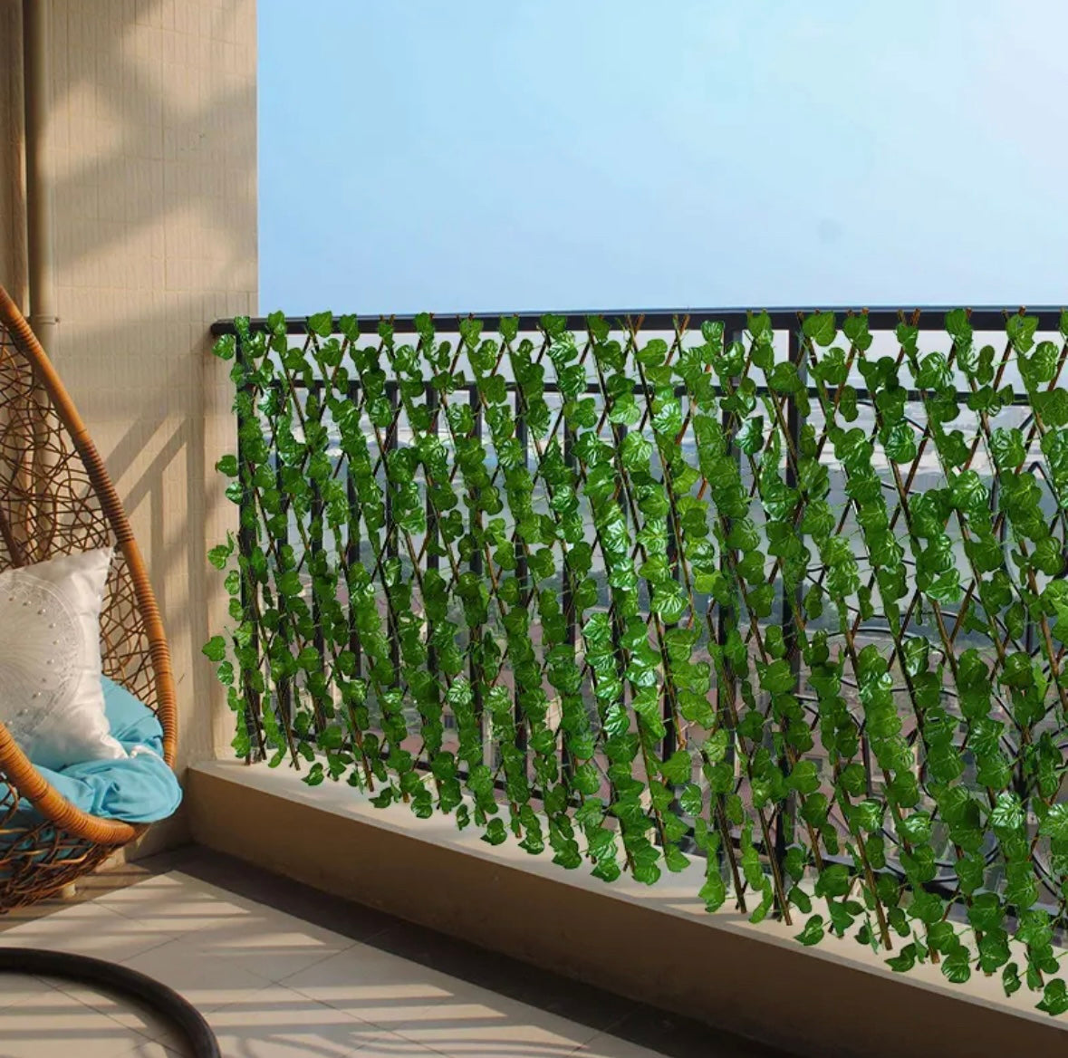 Artificial leaf fence fixed on a rail of balcony 